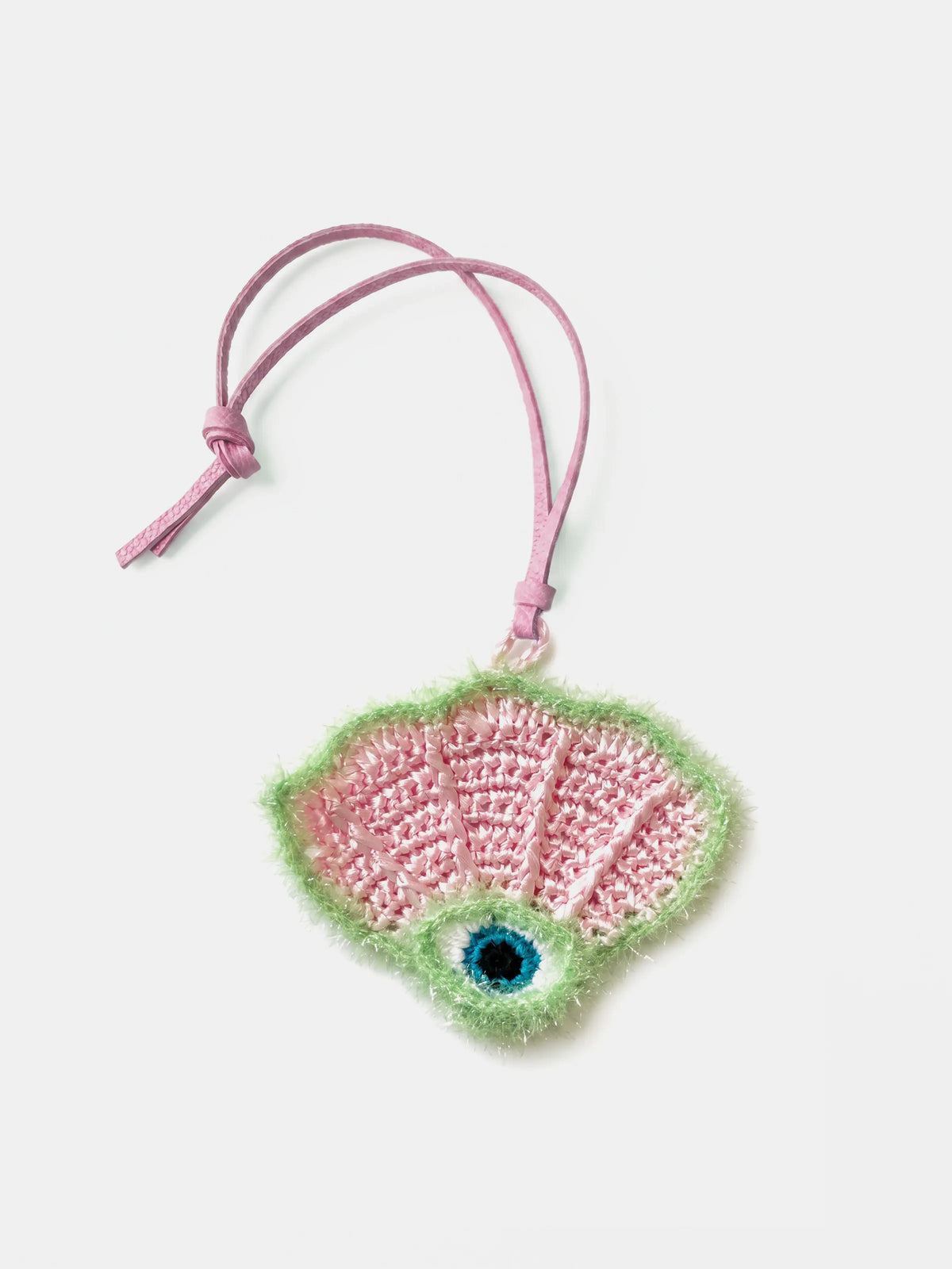 A pink scallop raffia charm with a pink leather strap