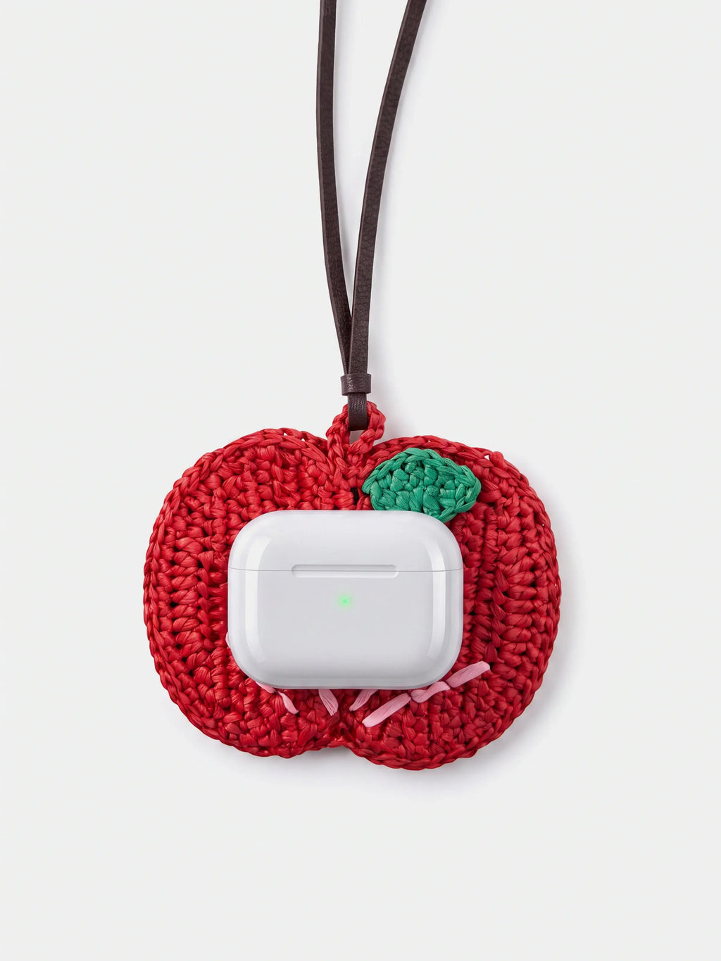 a red apple charm that holds earbuds