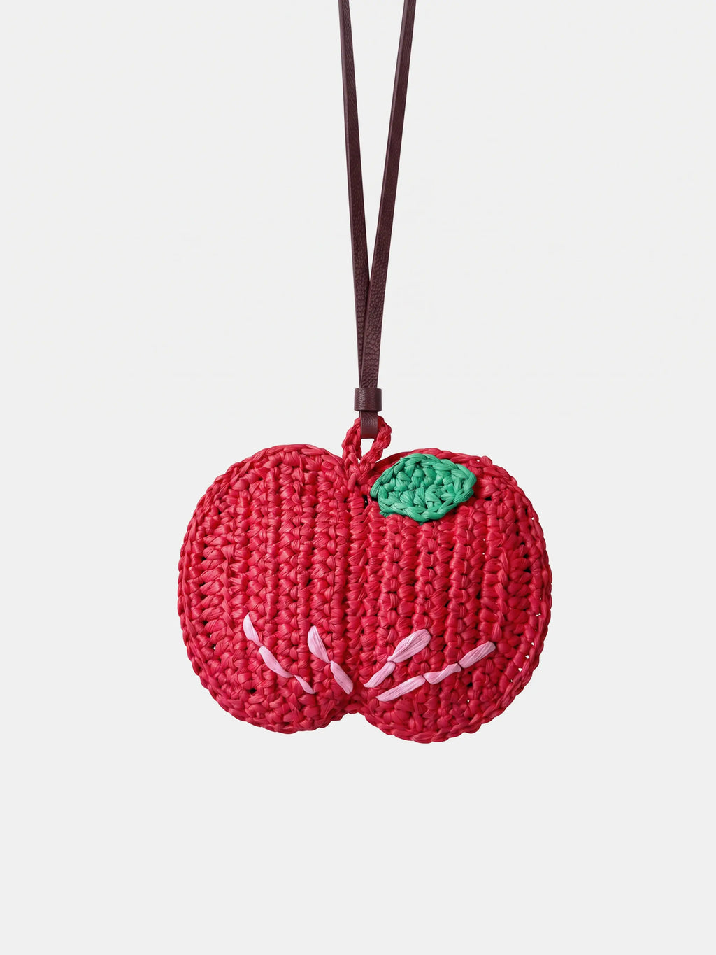 red apple charm and AirPods pouch