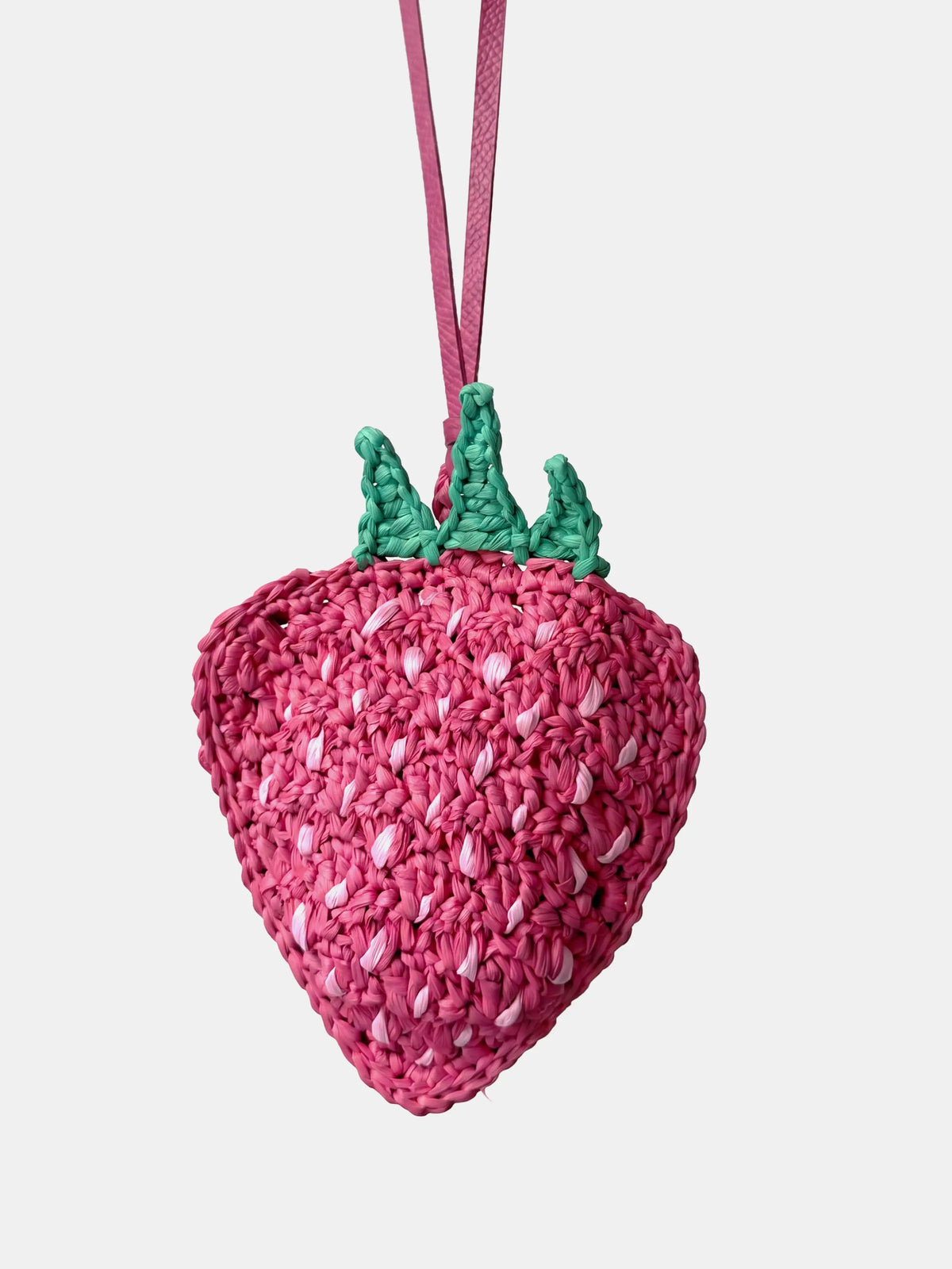 a pink strawberry charm and earbuds pouch