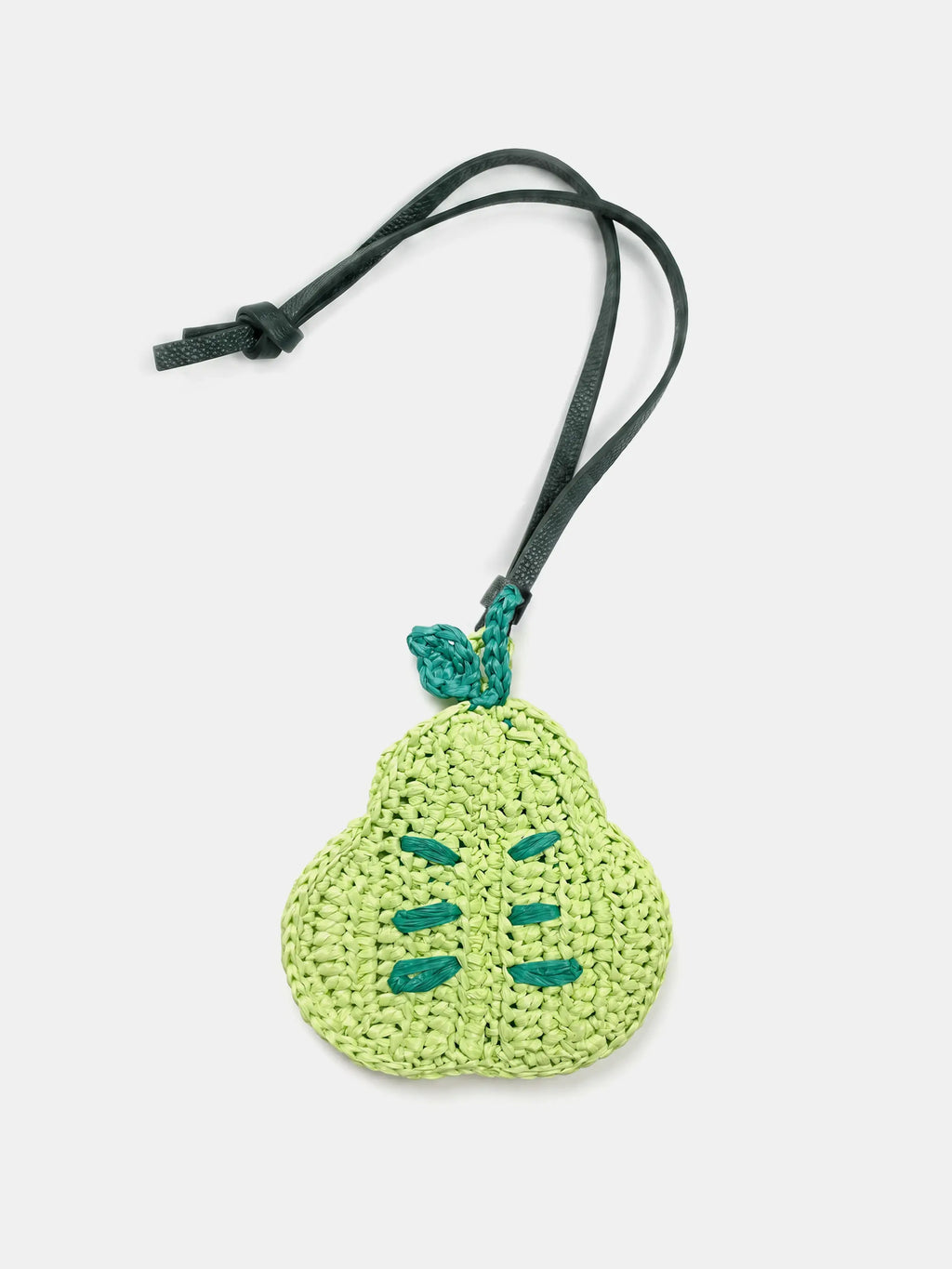 A light green crocheted raffia pear bag charm with a dark green strap.