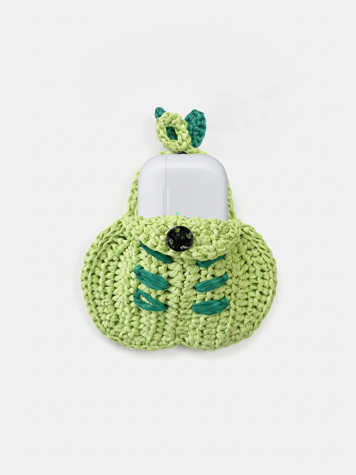 A green pear bag charm that holds AirPods Pro