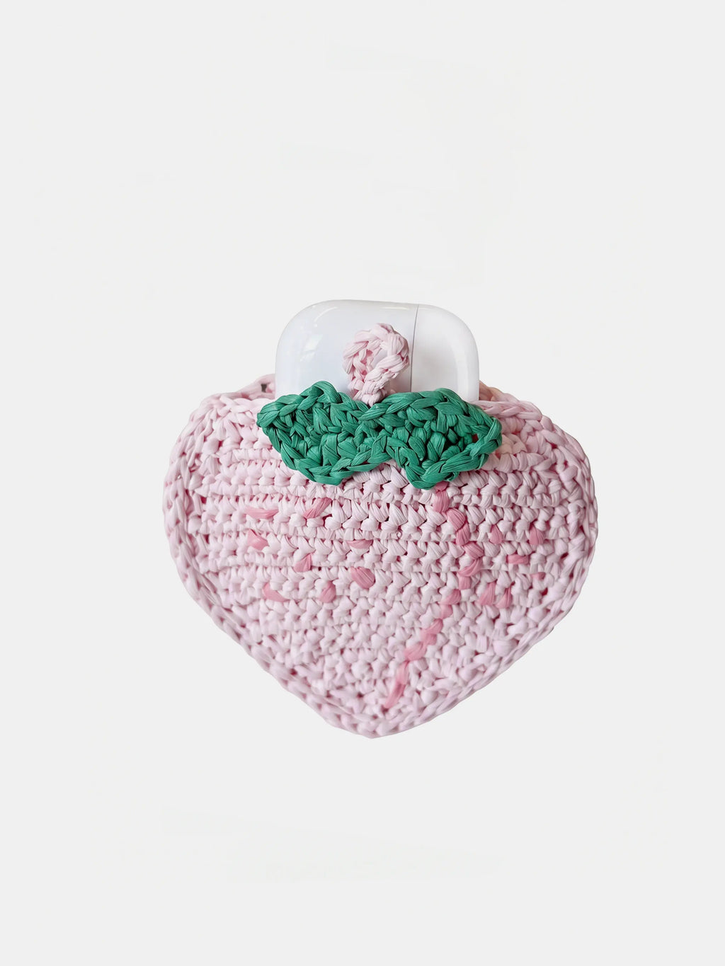 A pink crocheted peach charm that holds AirPods Pro