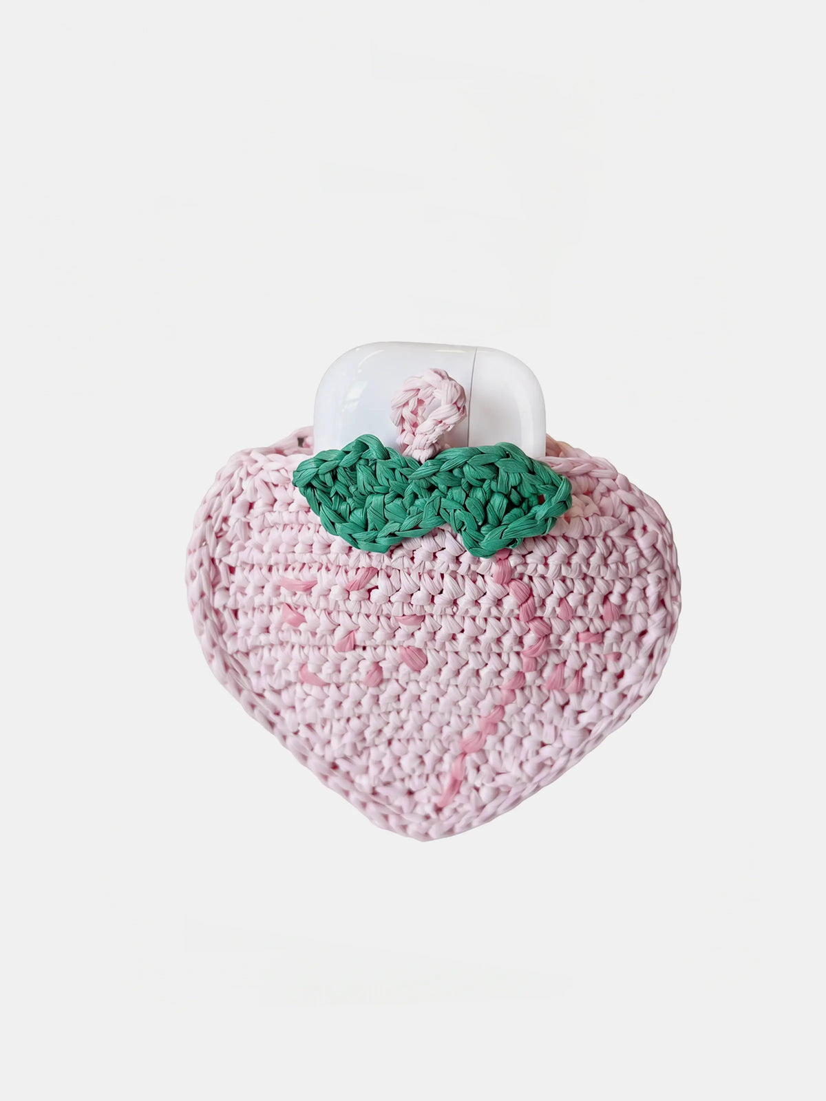 A pink crocheted peach charm that holds AirPods Pro
