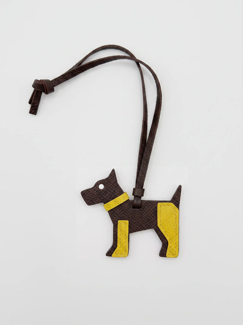a yellow and brown dog leather charm