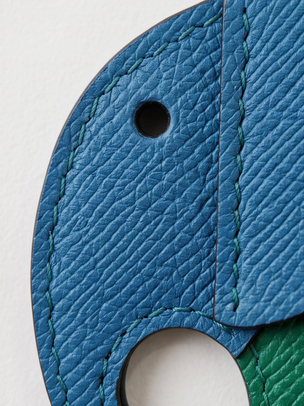 Close-up of a textured leather elephant charm