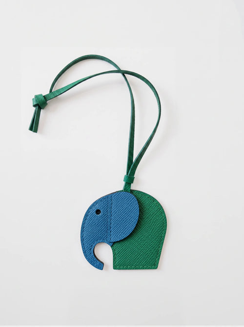 a leather elephant charm with a removable strap