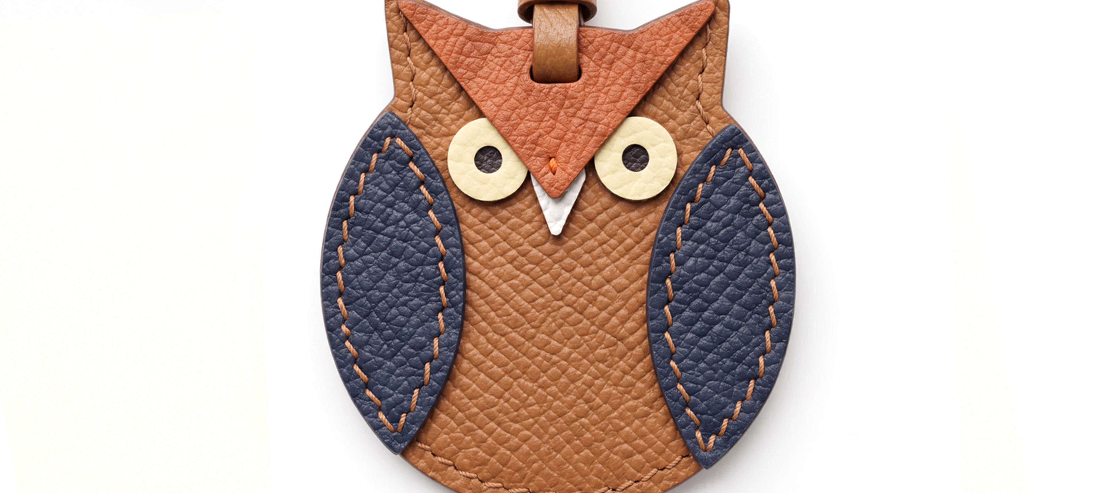 an owl leather charm